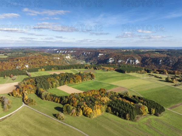 Aerial view of Upper Danube Valley surrounded by autumn vegetation, on the horizon Werenwag Castle,