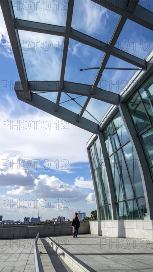 Modern architectural framework with glass and steel structure, glass facade with a greed of steel