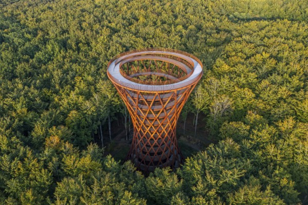 Aerial view over 45-meter-tall hyperboloid observation tower in forest near Gisselfeld monastery at