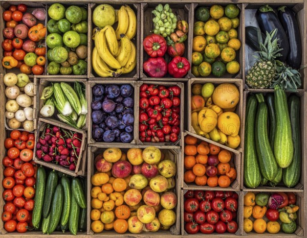 Fresh fruits and vegetables in a market display, aerial view perpendicular top down, healthy eating