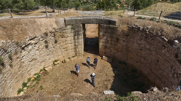 Group of visitors, Mycenaean dome tomb, archaeological site, UNESCO World Heritage Site, Mycenae,