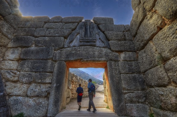 HDR, sky changed, couple walking through a huge stone gate, lion gate, Mycenae, archaeological