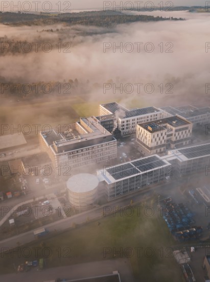Industrial complex and natural environment shrouded in thick fog, new hospital health campus