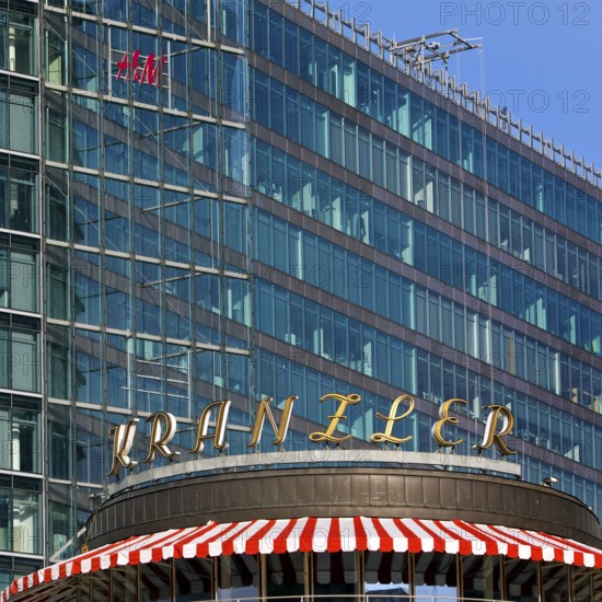 Historic Café Kranzler logo with modern office building and H&M logo on Kurfürstendamm,