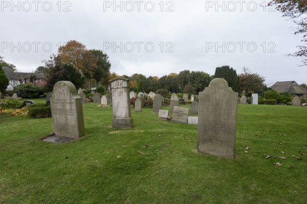 Cemetery of St John's Church with gravestones telling the story of seafarers, known as talking