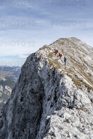 Mountaineer on the ridge of the Gamsjoch, transition to the main summit of the Gamsjoch, in autumn,