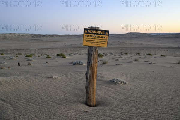 Restricted Area sign in the desert sand, Kolmanskop, diamond restricted area, near Lüderitz, Karas