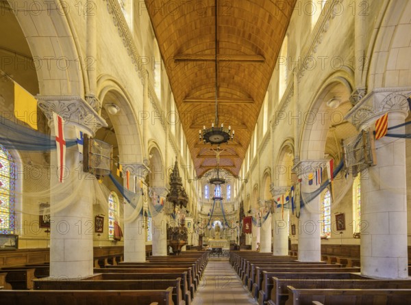Church of Saint Martin decorated with flags and fishing nets, Yport, Département Seine-Maritime,