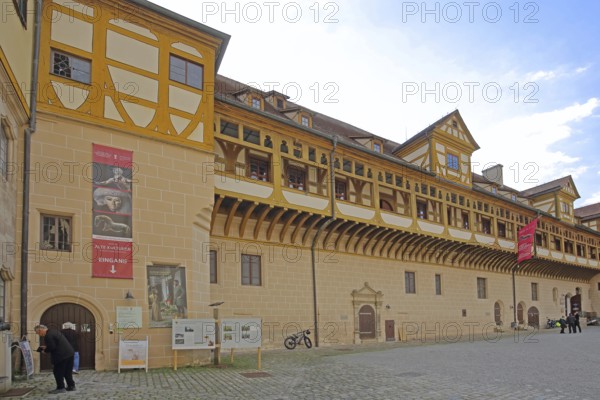 Inner courtyard of Hohentübingen Palace, half-timbered house with arcade, entrance, museum