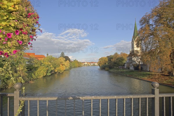 Collegiate Church of St Moriz built 14th century and Neckar with bridge railing and flower