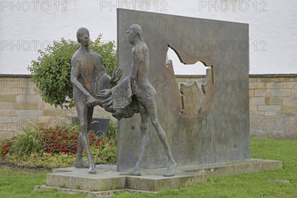 Sculpture Martin of Tours by Karl Ulrich Nuss, Saint Martin sharing his cloak with a beggar, symbol