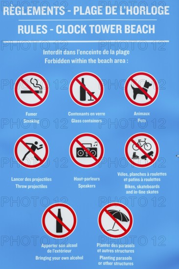 Posted rules sign with pictograms showing various restrictions at Clock Tower Beach, Old Port of