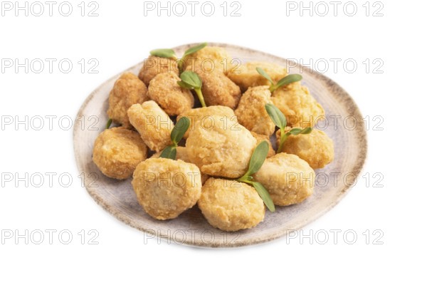Fried crispy Chicken Nuggets with ketchup, microgreen isolated on white background. side view,