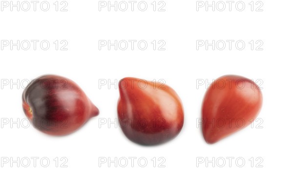 Red Heart shape tomatoes isolated on white background. Side view, copy space, healthy food,