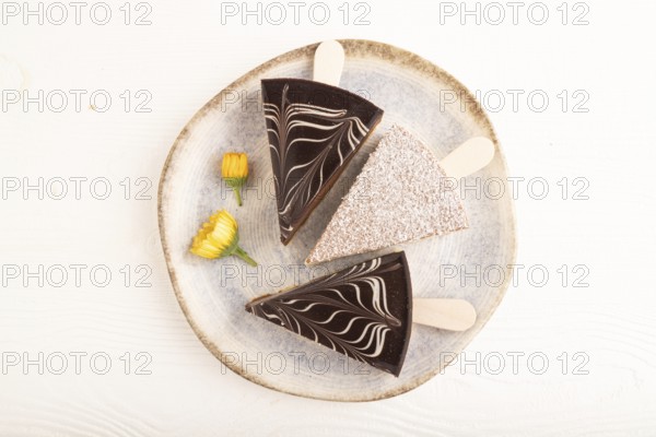 Chocolate and Vanilla Cake pops Marshmallow on white wooden background. top view, flat lay, copy