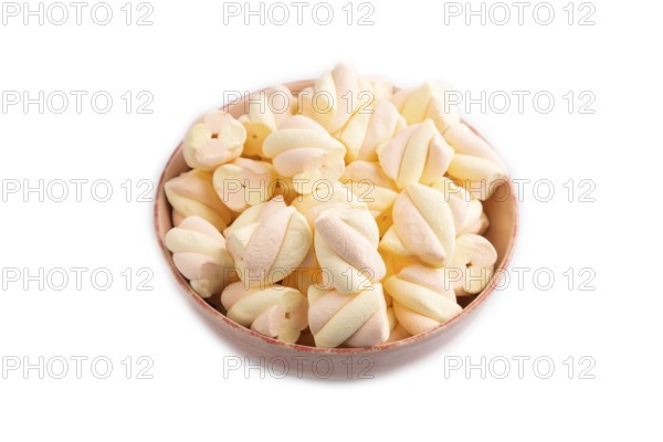 Orange and pink marshmallow in ceramic bowl isolated on white background, side view, copy space,