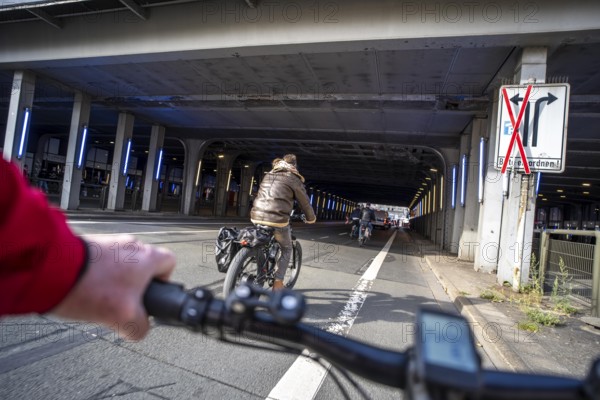Riding a bike on a bike lane, at Essen main station, tunnel in the city centre of Essen, North