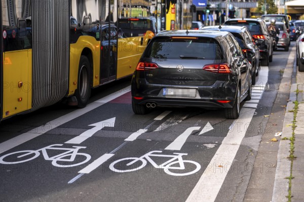 Cycle path, cycle lane, marked in red to draw the attention of motorists to the cycle path, between