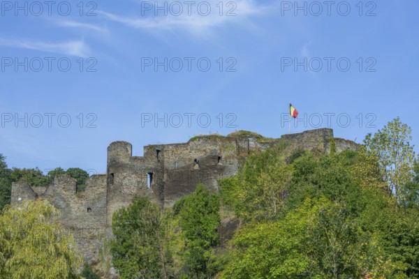9th century medieval ruined hill castle overlooking the city La Roche-en-Ardenne in summer,