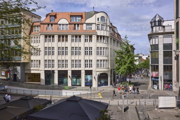 City centre, general architecture, shops, pedestrians as accessories, elevated perspective, blue