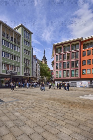 Square, general architecture, pavement slabs, trees, steeple of the collegiate church Stuttgart,