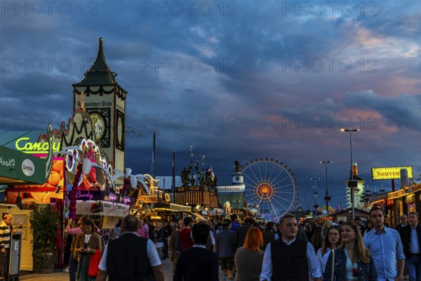 Visitors on the evening festival meadow, Theresienwiese, Oktoberfest, Munich, Upper Bavaria,
