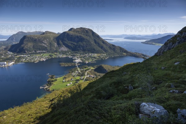 Expansive coastal view with mountains, sea and the village of Midsund, Otroya or Otrøya Island,
