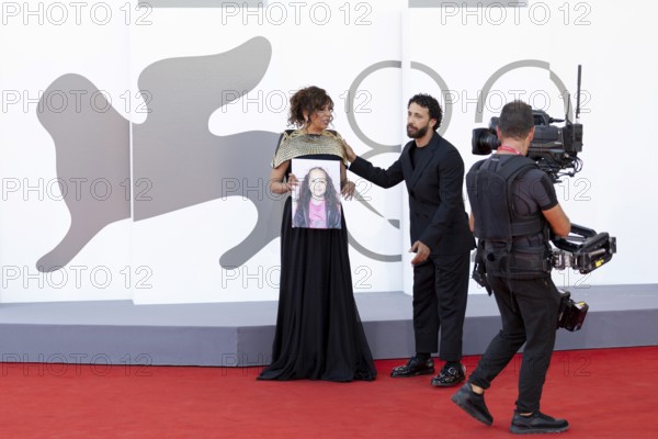 Venice, Italy - 3 September 2025: Kaouther Ben Hania with a portrait of five-year-old Palestinian