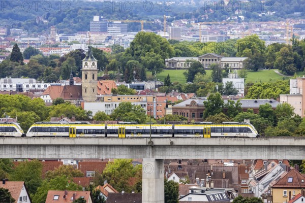 SWEG regional train travelling on the Schusterbahn, Münster viaduct with Bad Cannstatt and