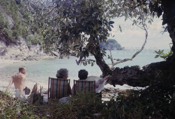 British expatriates enjoying leisure time in coastal bay sandy beach, photos of Singapore and Johor