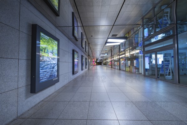 Empty corridor of a modern underground station with tiles and lighting, Münchner Freiheit, Munich,