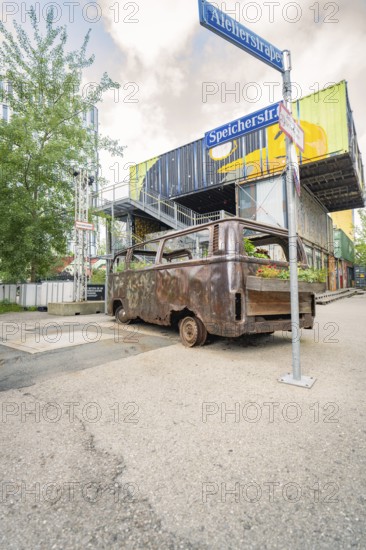Industrial area with old, planted bus and container buildings in the background, Werksviertel