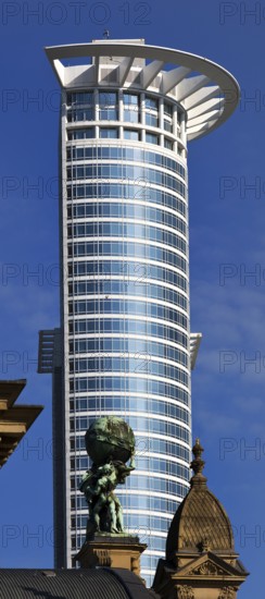 Central station with Atlas carrying the globe on his shoulders in front of the DZ Bank tower block,