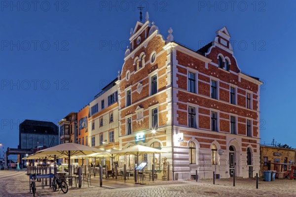 Night shot, magnificent building with outdoor seating and sunshade, built in 1889, Hiddenseer