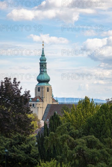 Church tower of St Stephan in Baden in front of a blue sky with clouds, Baden, Lower Austria,