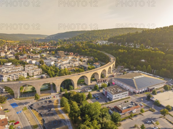 Town view with dominating viaduct running through an urban and natural landscape, small town pearl