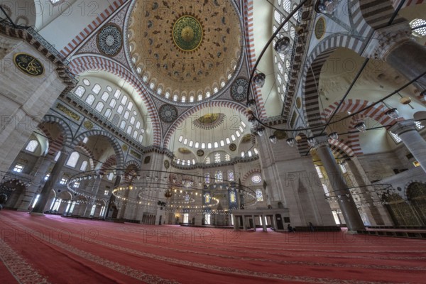 Wide angle view of the suleymaniye mosque interior in istanbul, turkey, showing the vastness of the