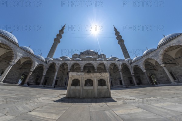 Wide angle view of the courtyard of suleymaniye mosque in istanbul, turkey, featuring intricate