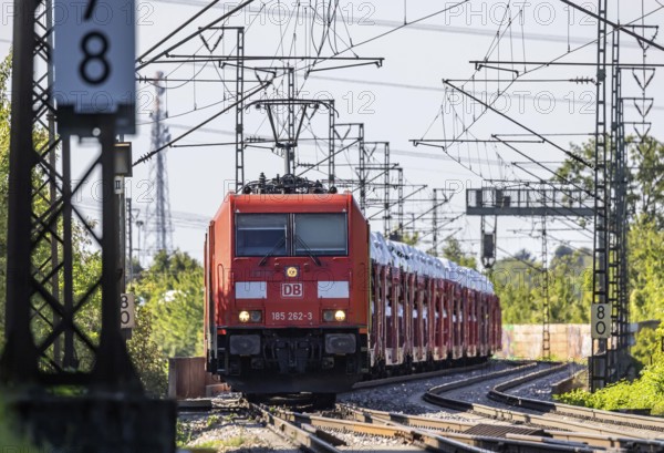 Car train with new cars on the railway line near Stuttgart. The so-called Schusterbahn is a bypass