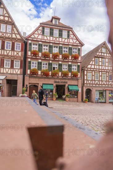 Inviting atmosphere with half-timbered houses and floral decorations, small town pearl Calw, Black
