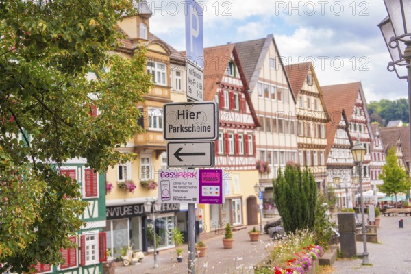 Town views with half-timbered houses and street signs, small town pearl Calw, Black Forest, Germany