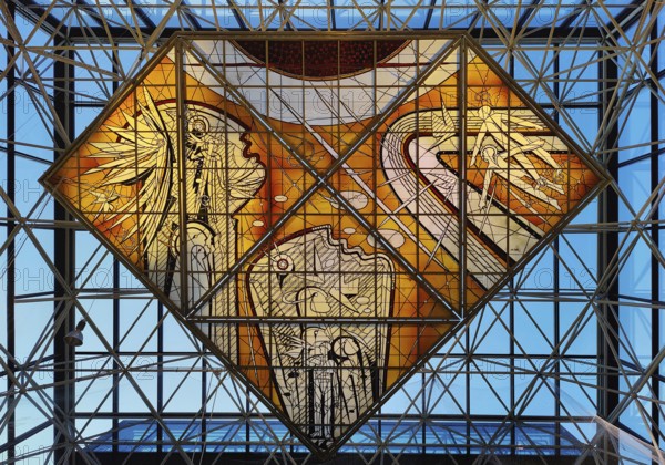 Stained glass artwork entitled Icarus, one of two glass artworks by Leifur Breidfjörd at Keflavik
