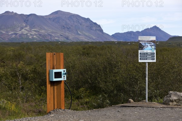 Car park at Brúarfoss waterfall with EC machines for paying in the countryside, South Iceland,
