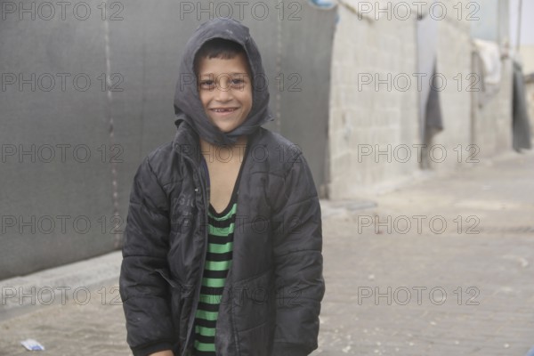 Syrian children playing in a refugee camp near the Turkish border on World Children's Day. Aleppo,