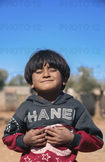 Syrian children playing in a refugee camp near the Turkish border on World Children's Day. Aleppo,