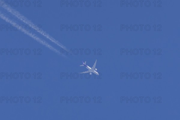 Airbus A300-600RF jet aircraft of FedEx Express airlines in flight with vapour trails or contrails