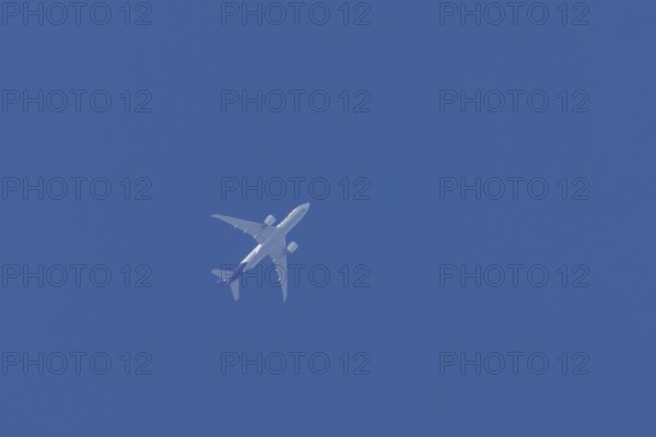 Airbus A300-600RF jet aircraft of FedEx Express airlines in flight in a blue sky, England, United