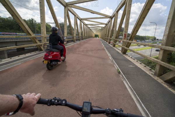 Cycling south of Utrecht, cycle path bridge over a motorway, long-distance cycle path to Houten,