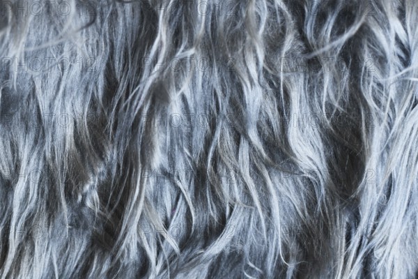 Close up of shaggy gray synthetic fake fur
