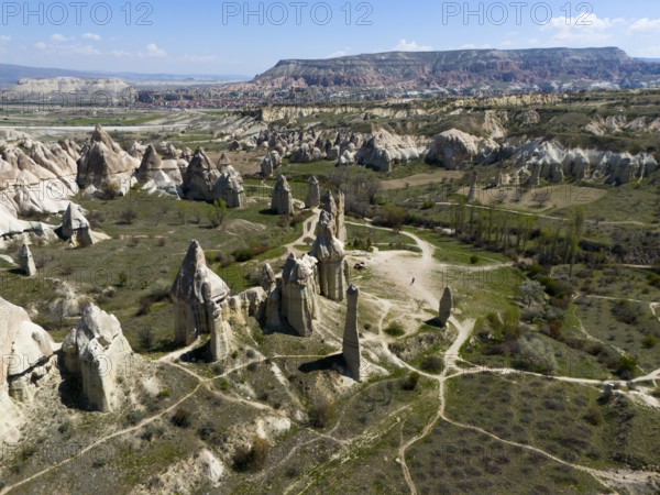 Wide valleys and impressive rock formations stretch out in Cappadocia, aerial view, Love Valley,